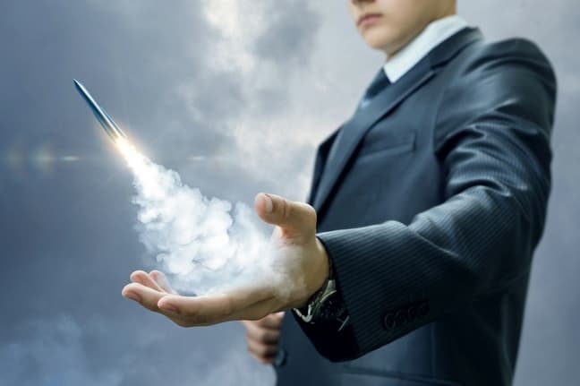 Businessman launches a missile from the hand.