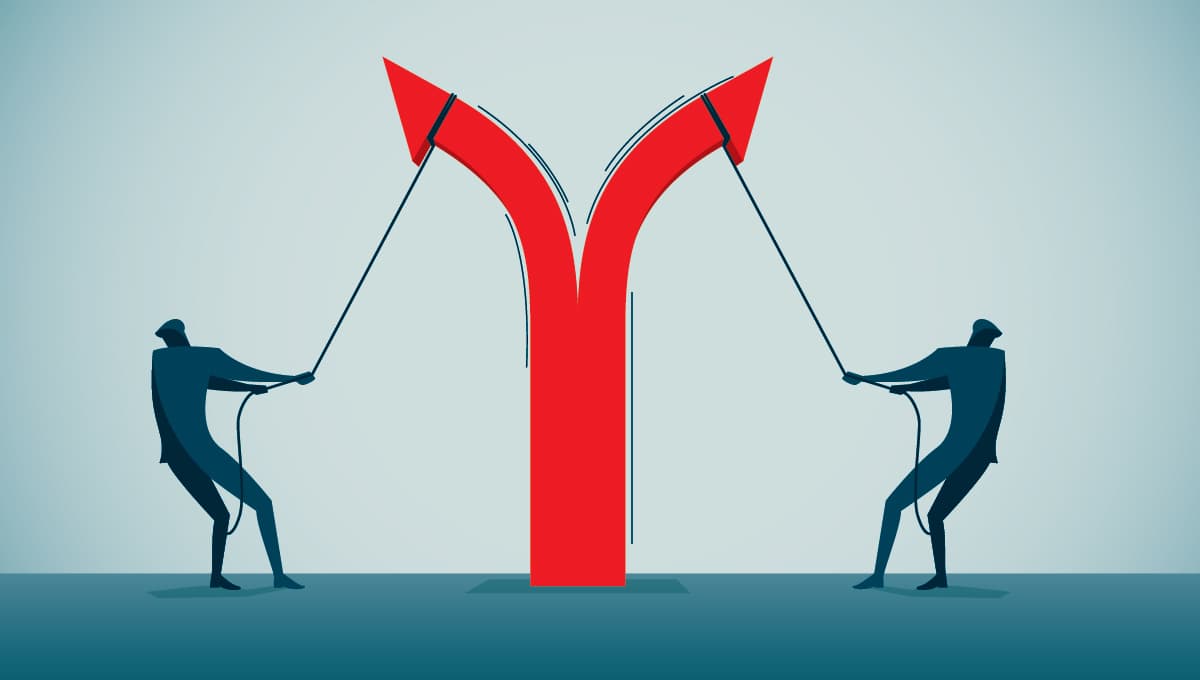 two businessmen pull apart an arrow, causing it to point in opposite directions