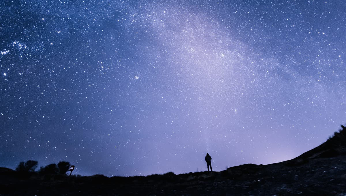 Man staring at a starry sky