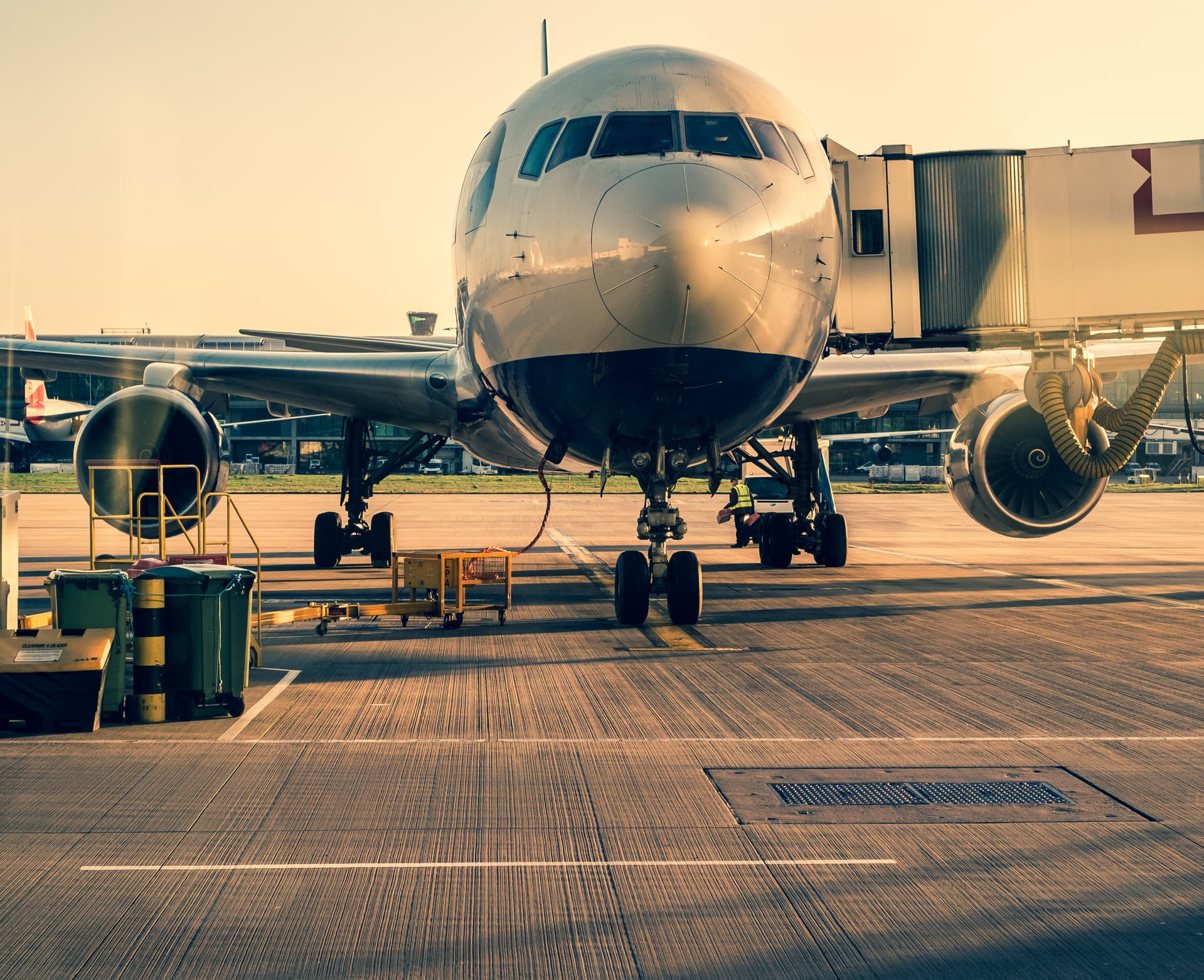 Front view of landed airplane in a terminal of Heathrow airport in London.
