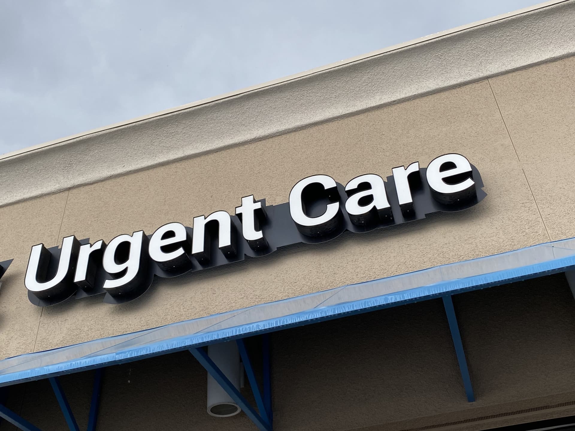 Building with urgent care sign