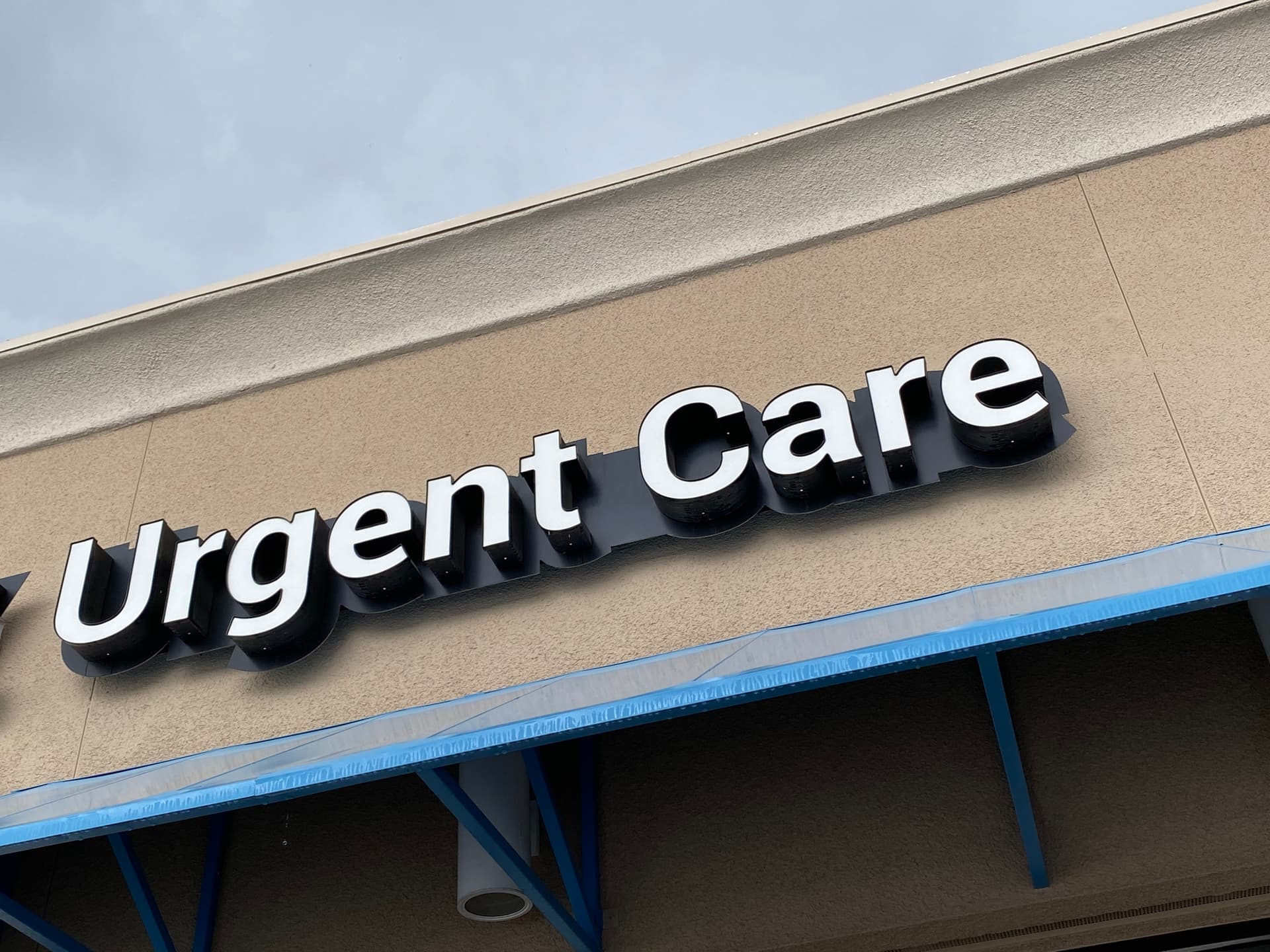 Building with urgent care sign