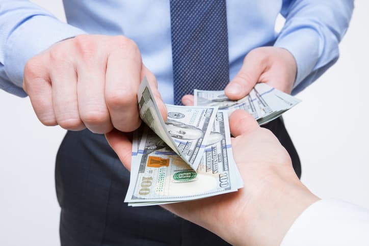 Human hands exchanging money - closeup shot
