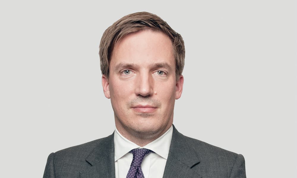 Martin Brand of Blackstone, headshot in dark gray suit