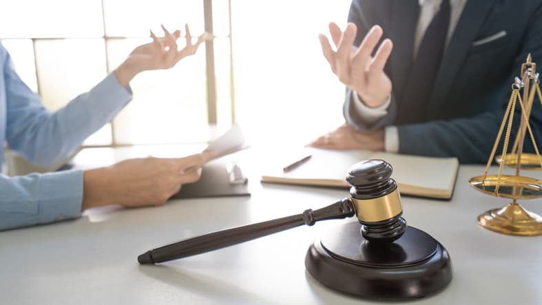 Lawsuit concept, Male lawyer consultant discussing with client in office.