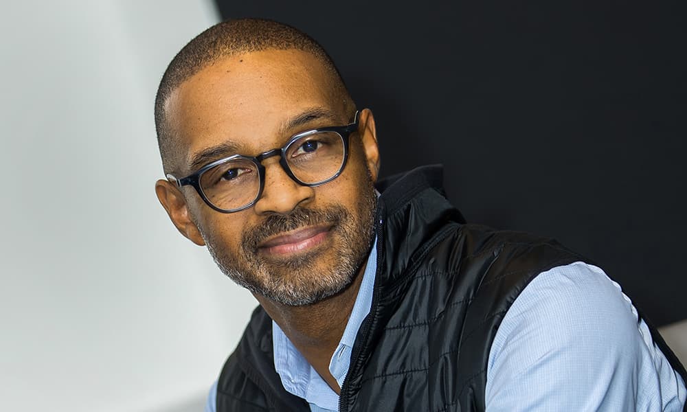 Michael Harris, NYSE, with glasses, light blue shirt and vest