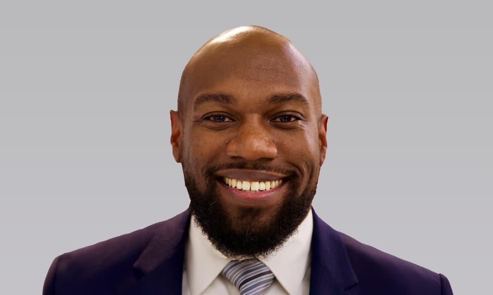 Headshot of Blackstone's Marcus Felder against a light gray background.