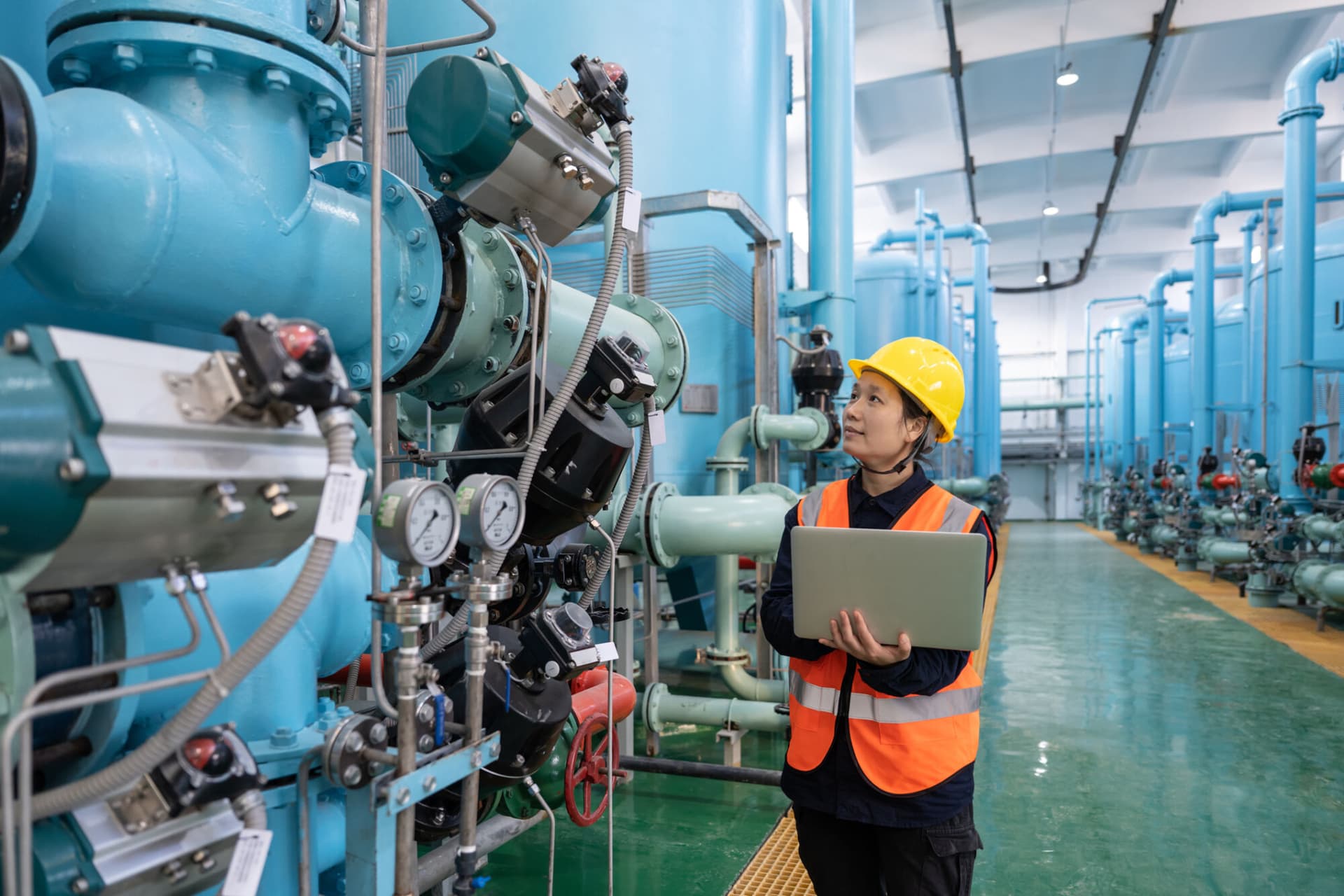 Chemical production interior, female worker