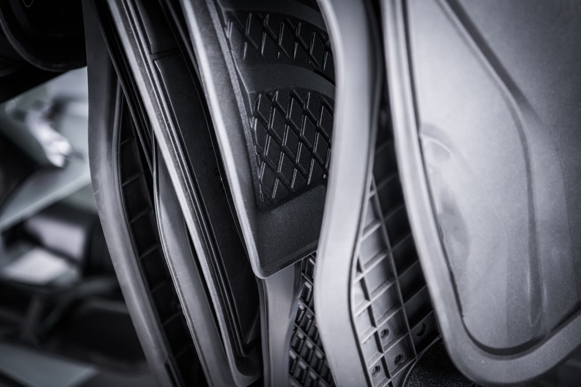 Car Floor Mats Selection on the Store Rack. Keeping Vehicle Clean Inside.