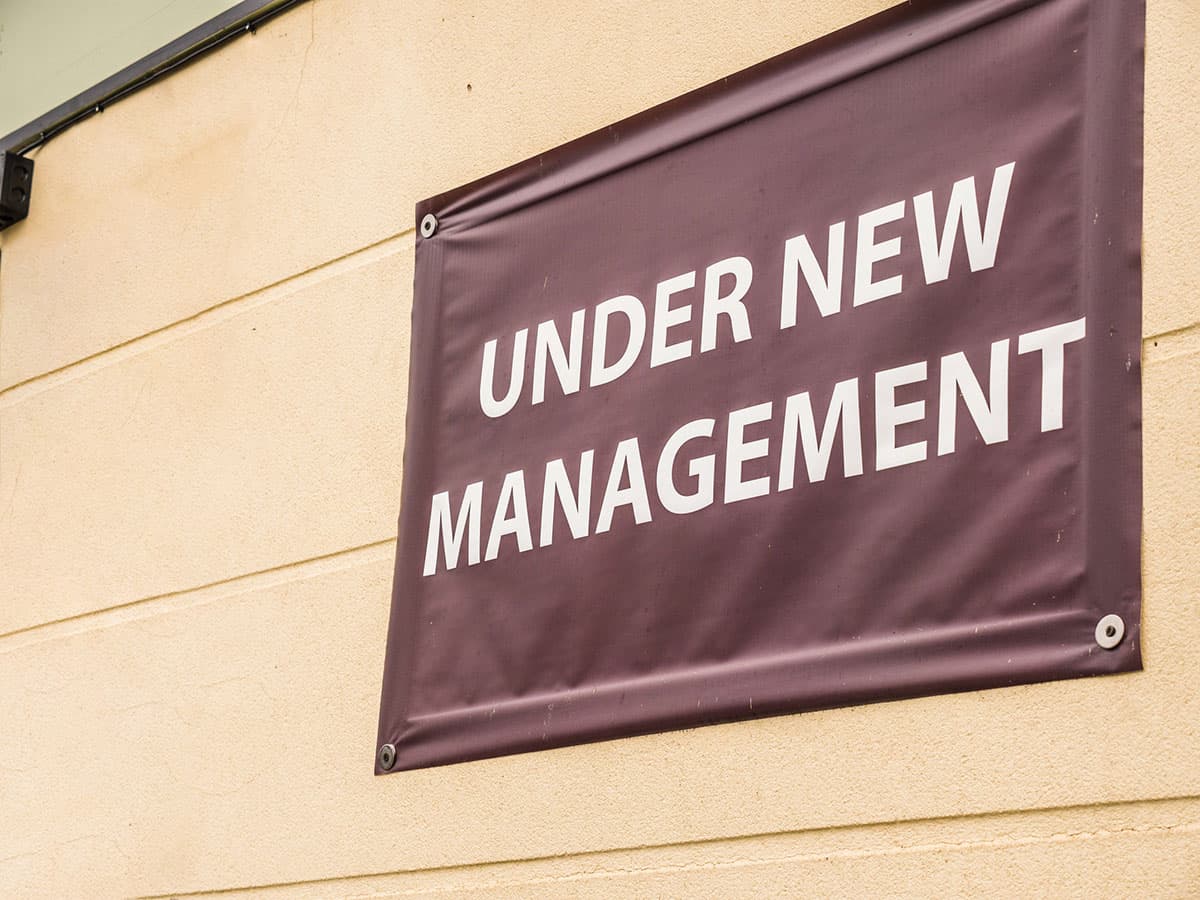 An "Under New Management" sign