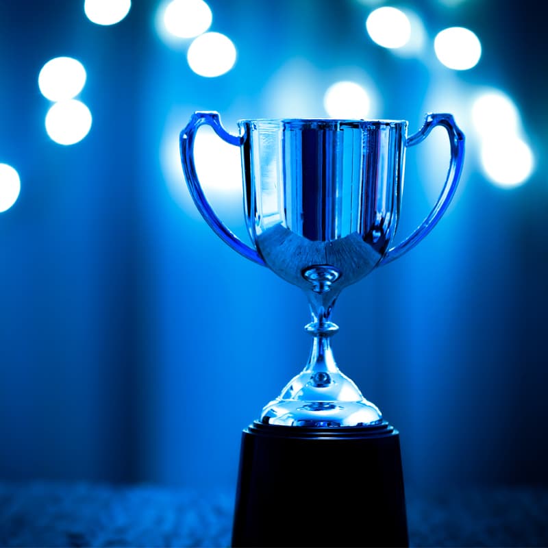 Photo of a trophy in blue light.