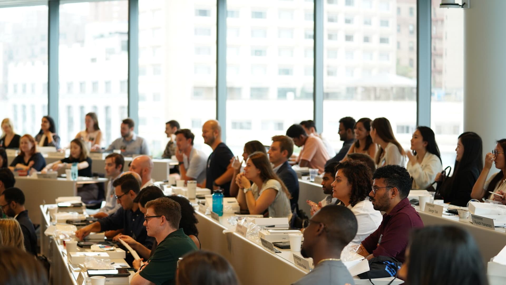 Students at Columbia Business School listen attentively during a class.
