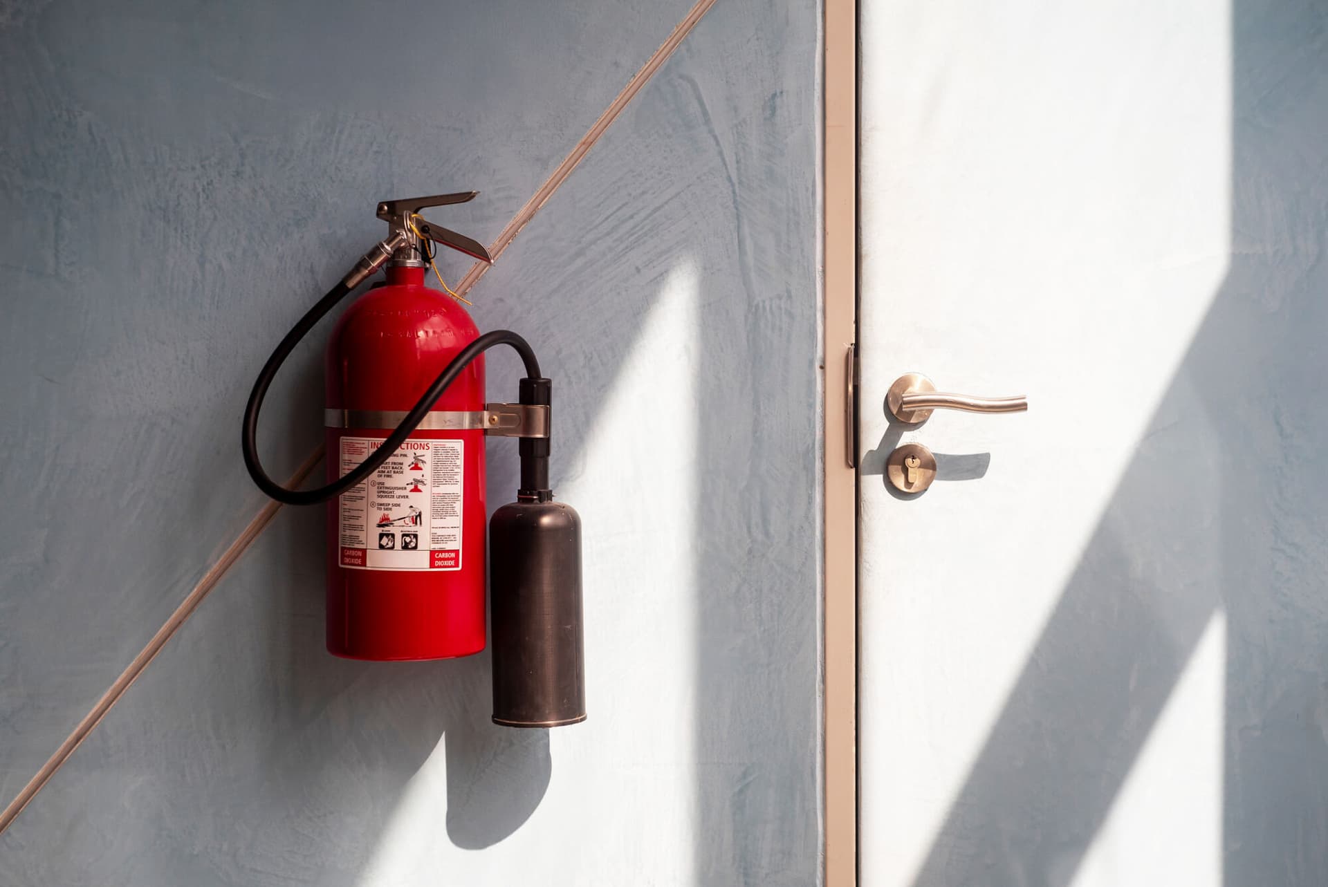 Fire extinguisher mounted on a wall, fire safety