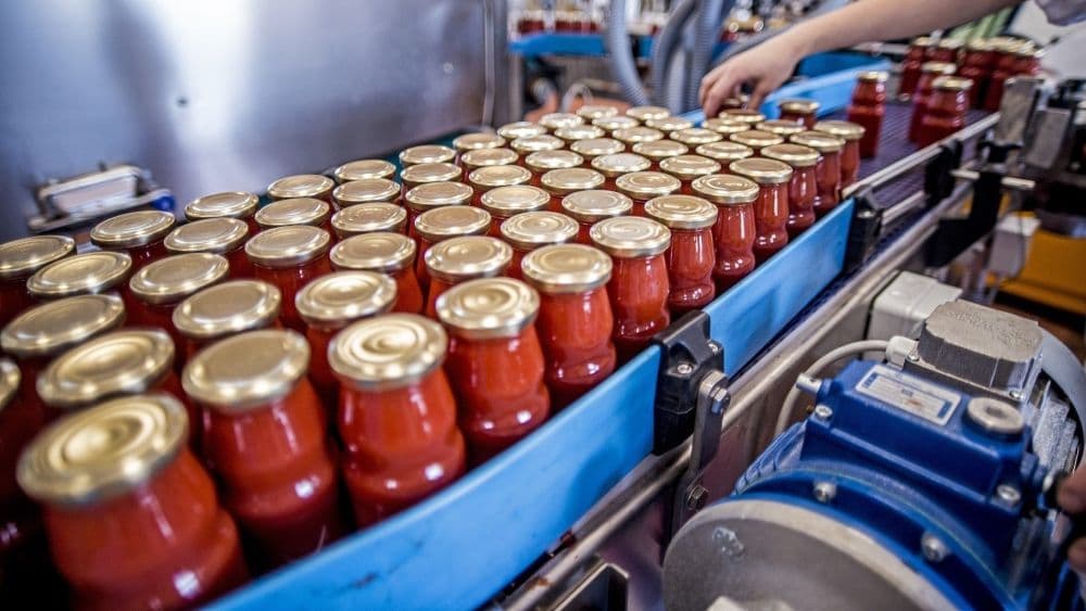 Sauces in bottles at a manufacturing plant.