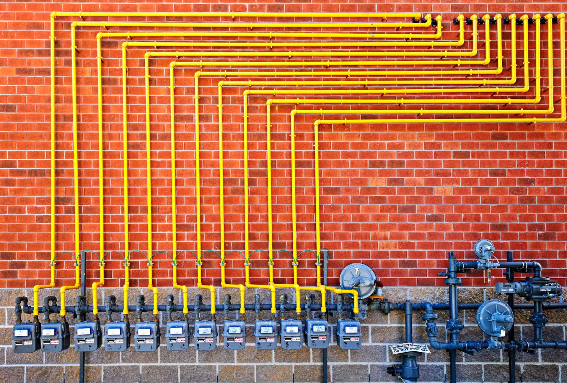 Natural gas meters with yellow pipes_Getty