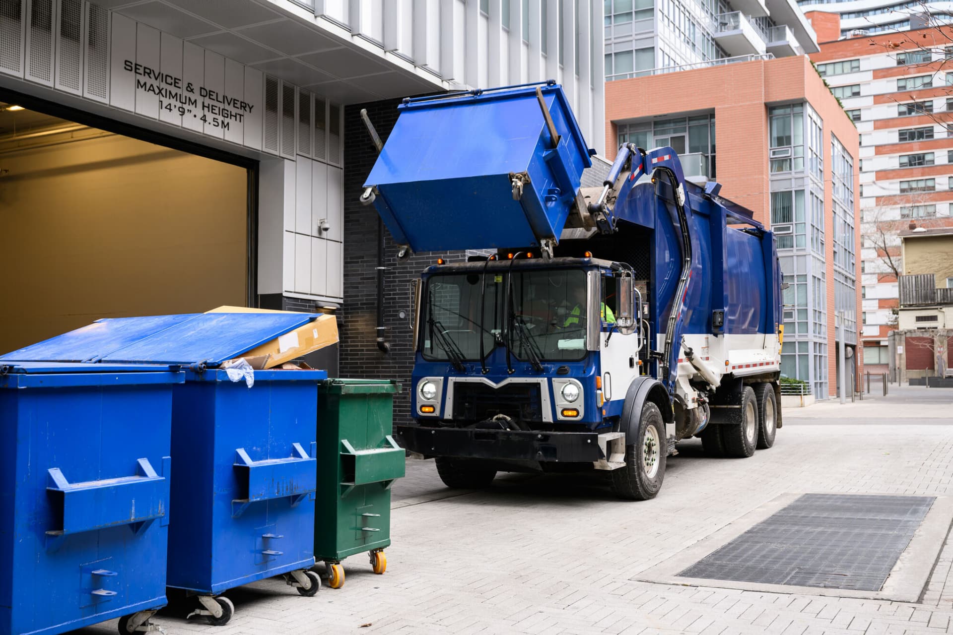 Garbage Truck Lifting Recycling Bin_Getty