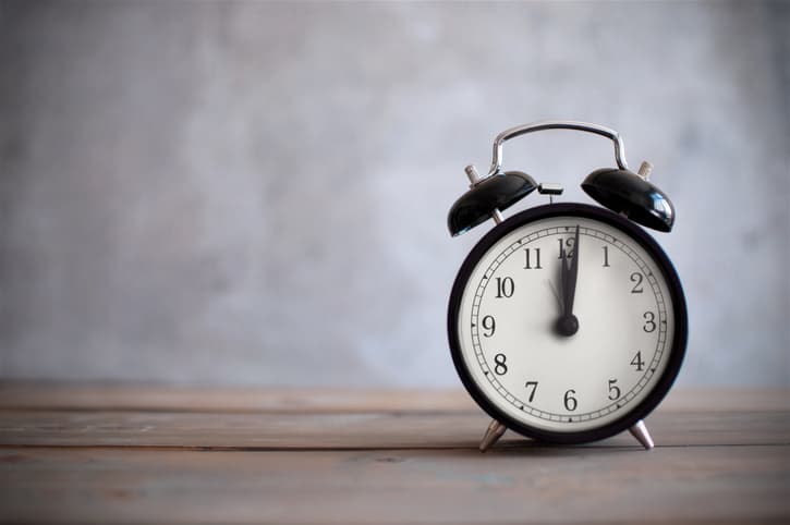 photo of clock with grey background