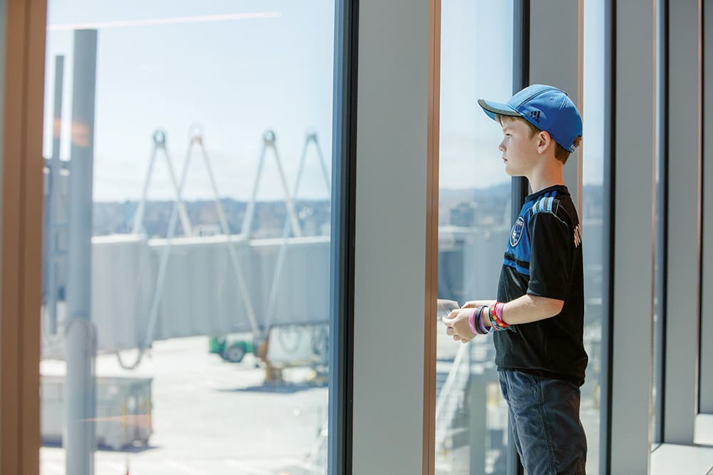 Boy looking through a window