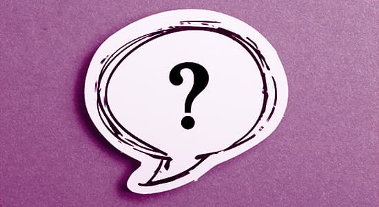 Question mark speech bubble isolated on purple background