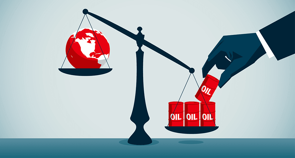 Set of scales with the globe on the left hand side and barrels of oil on the right hand side. A hand is adding extra barrels of oil to the right hand side, tipping the scales.