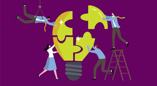 Team of people putting a lightbulb together