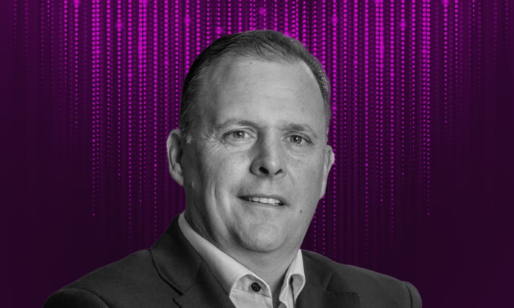 Headshot of BCI's Jim Pittman against a purple background