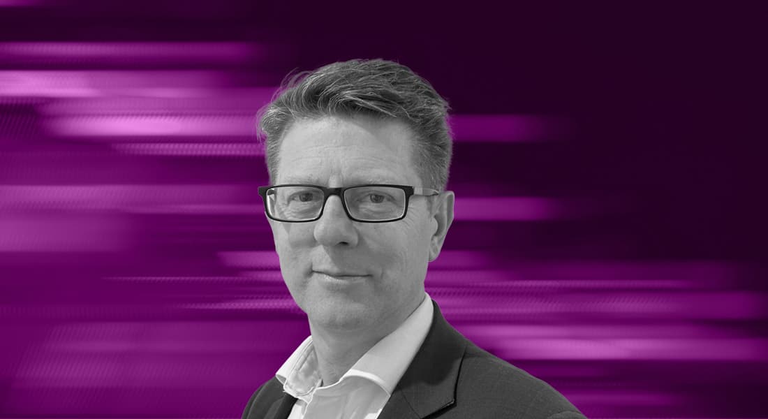 Headshot of S64's David Hallifax against a dynamic purple background