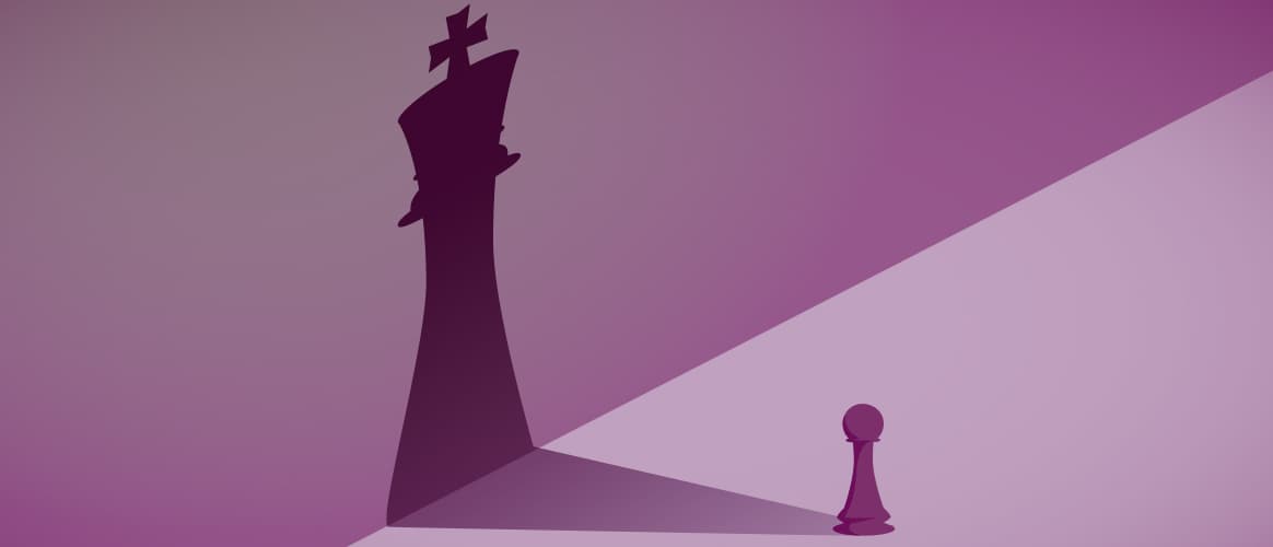 A pawn and a king chess piece
