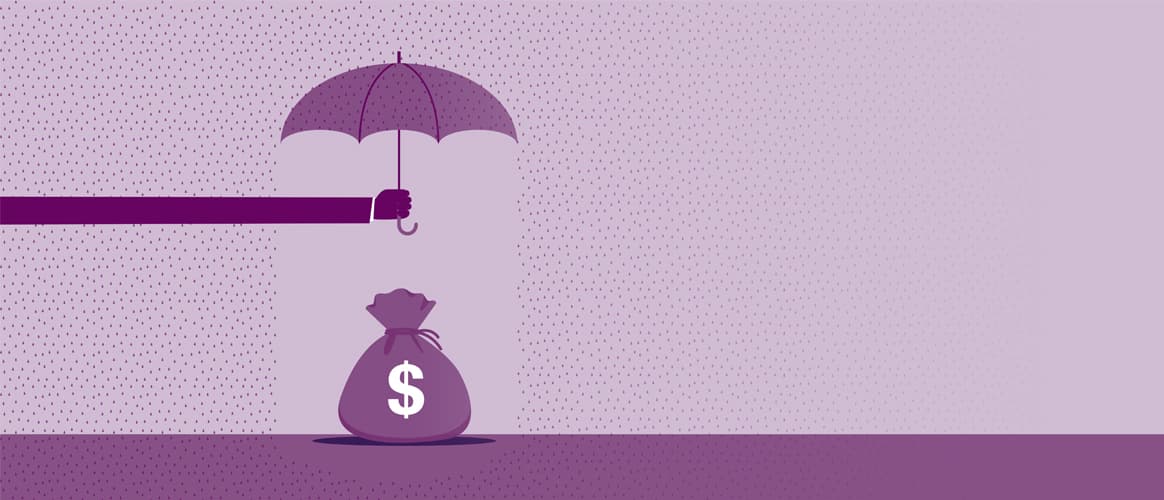 Hand holding umbrella over money, protecting capital