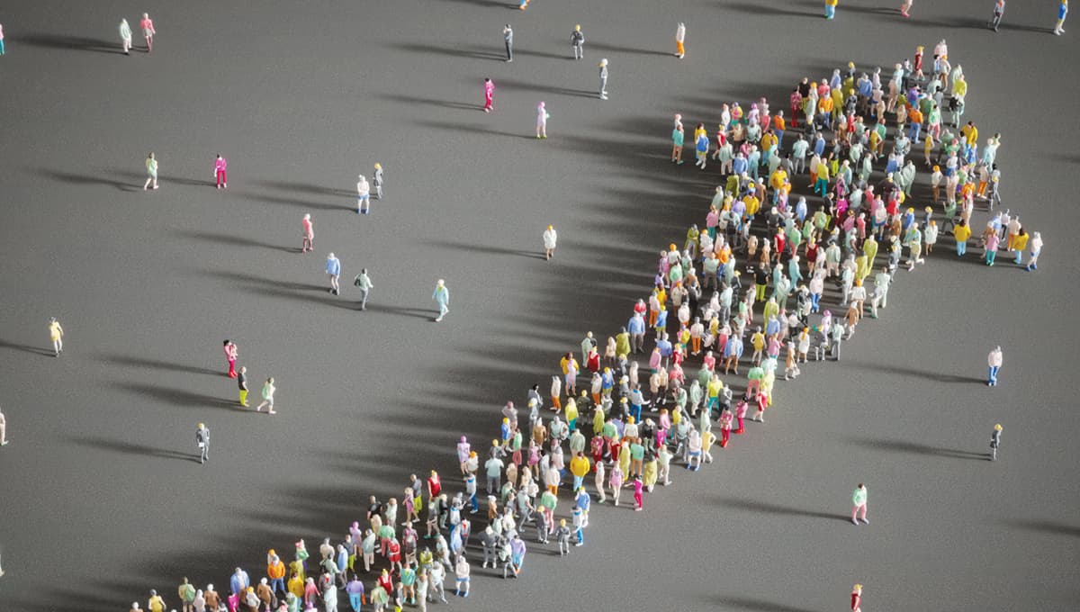 Group of people forming an arrow