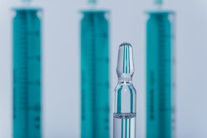 Three large vials and one small vial