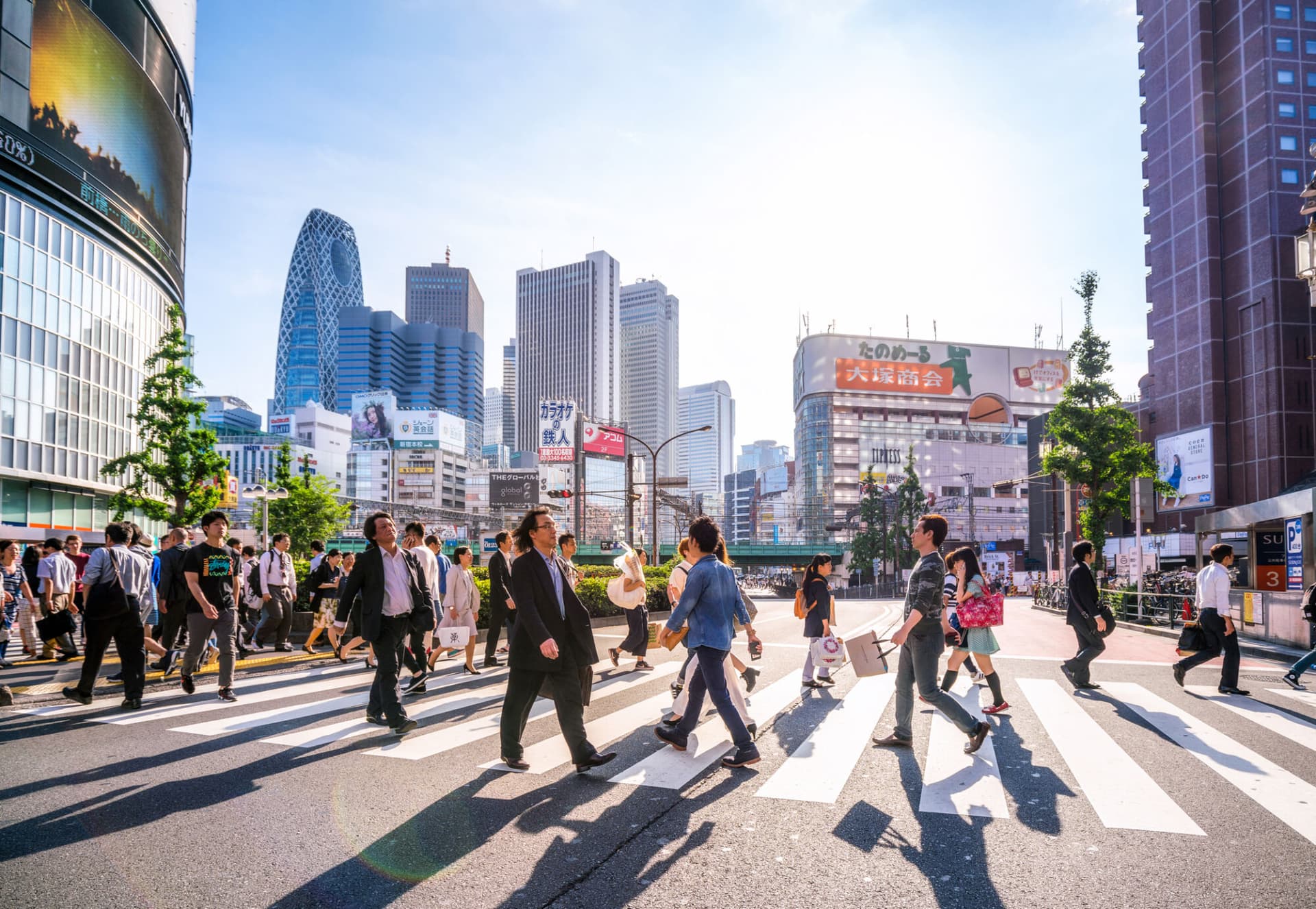 Crowded streets of Shinjuku shopping district with commuters