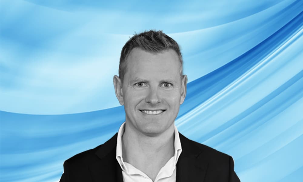 Headshot of Michael Bruun, co-head of Goldman Sachs Asset Management's private equity business, against a blue background