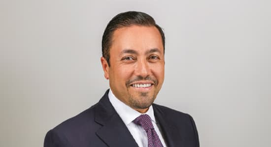 Investcorp's Hazem Ben-Gacem against a neutral background