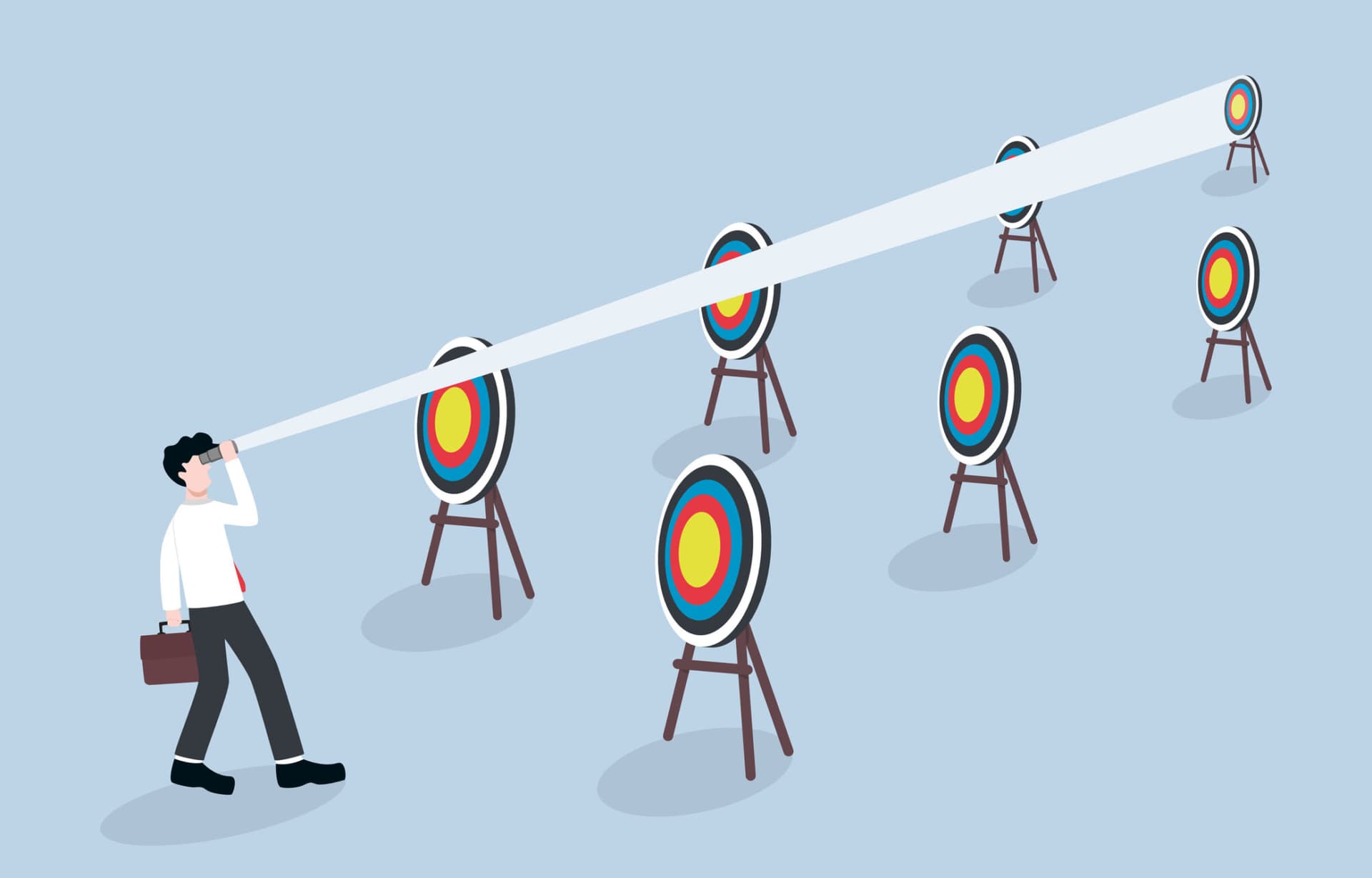 A business man looking past multiple bulleye targets to a final target in the distance