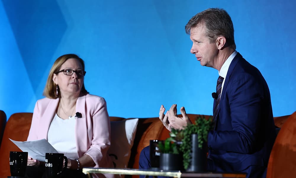 Holden Spaht on stage with PE Hub's MK Flynn at PEI Group's NEXUS 2026.