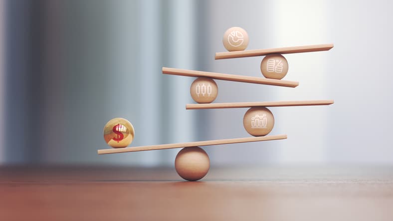 3d Render Yellow Red Metal Ball Dollar Symbol on Wooden Libra Scale and Wooden Financial Charts, Economy and finance concept, Depth Of Field