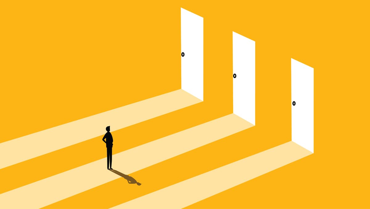 Man standing in front of three open doors