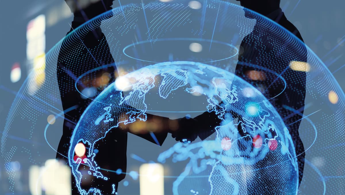 Image of shaking hands behind a globe.