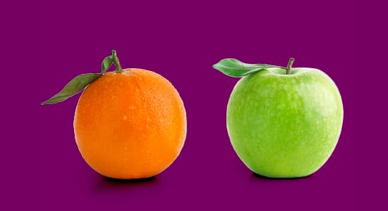 orange and an apple against a purple background
