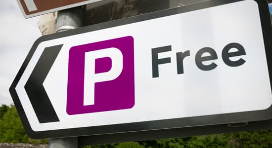A photo of a "free parking" sign
