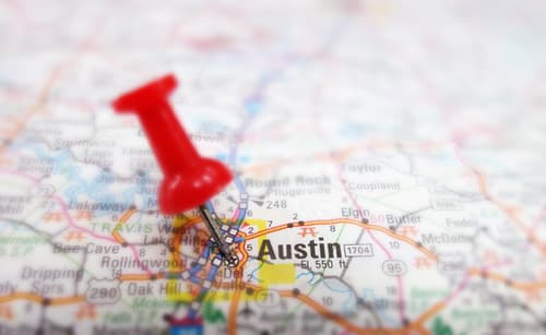 Picture of a map with a pinpoint on Austin, Texas.