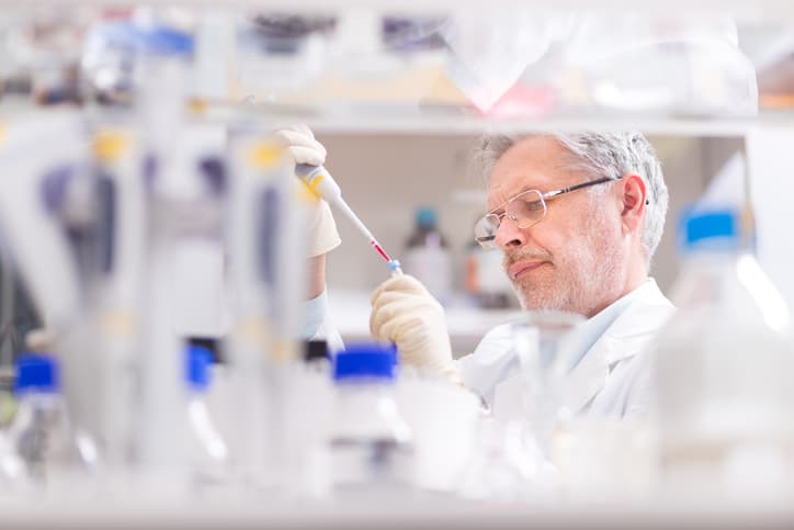 Life scientist researching in laboratory. Life sciences comprise fields of science that involve the scientific study of living organisms: microorganism, plant, animal and human cells, genes, DNA