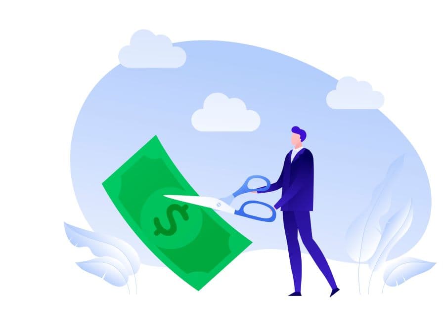 Photo illustration of man cutting money with scissors.