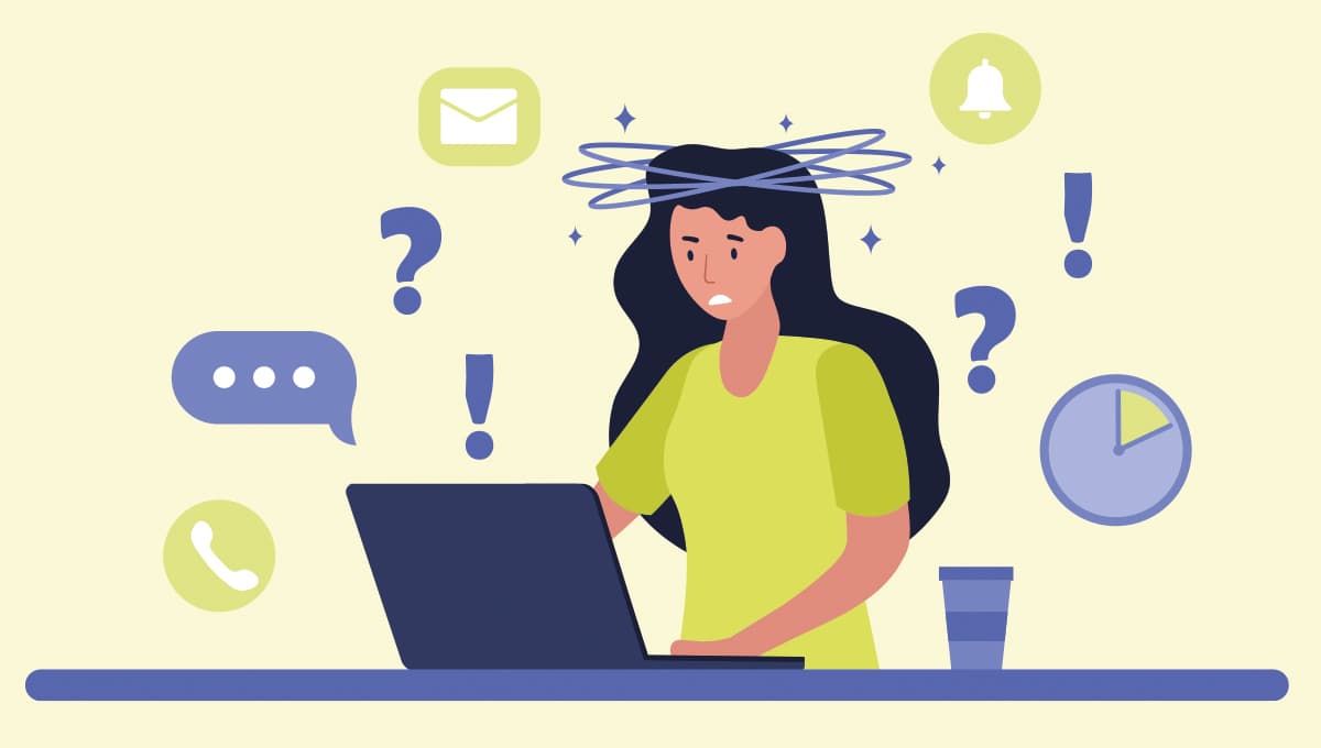 A woman working at a laptop appears bamboozled by regulation