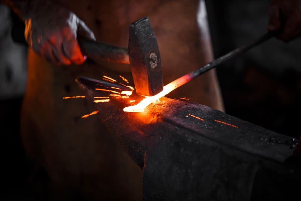 Photo illustrating concept of striking while the iron is hot.