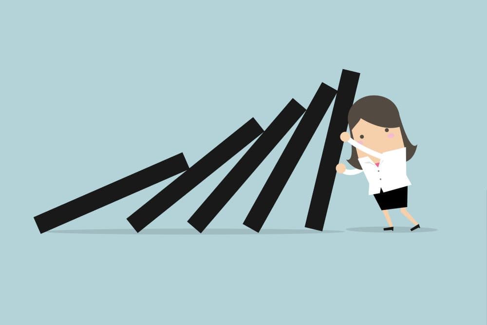 Illustration of a businesswoman fighting back against an economic downturn.