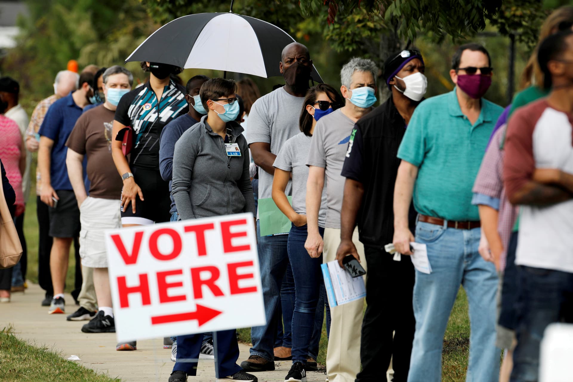 Image of people lined up to vote.