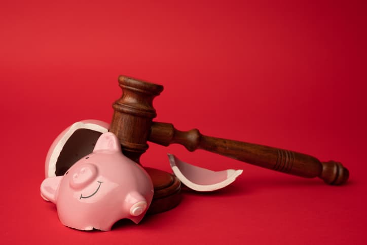 piggy bank broken with gavel